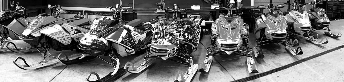 Ski-Doo Snow Mobiles with various SCS Unlimited Wraps on them.